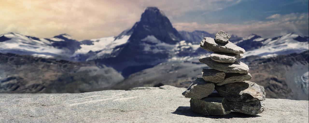 Stacked stones mark the path