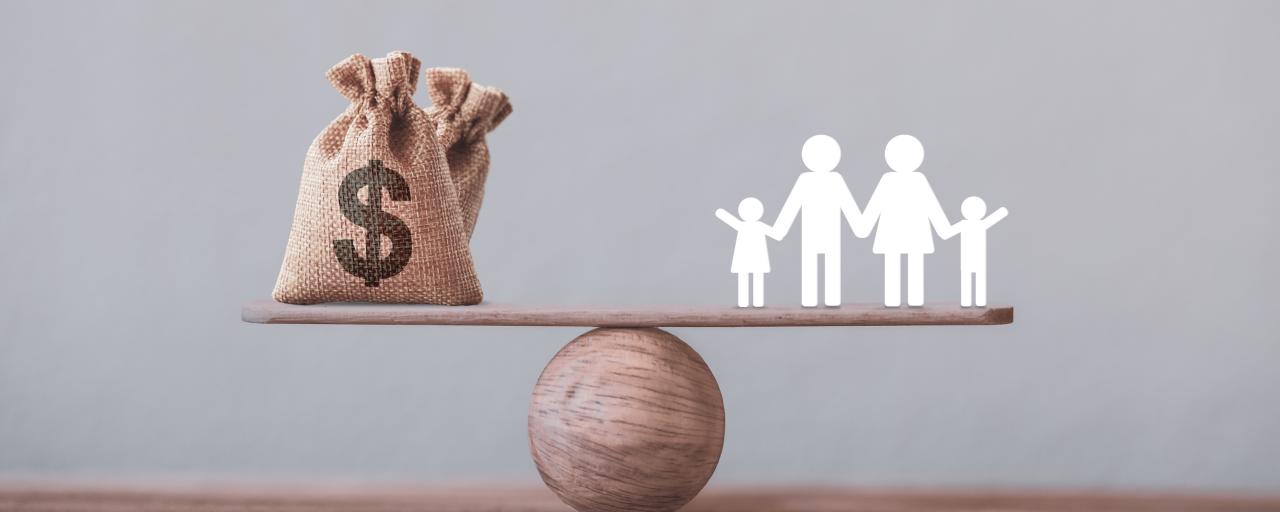 see-saw concept with money on one side and a family on another